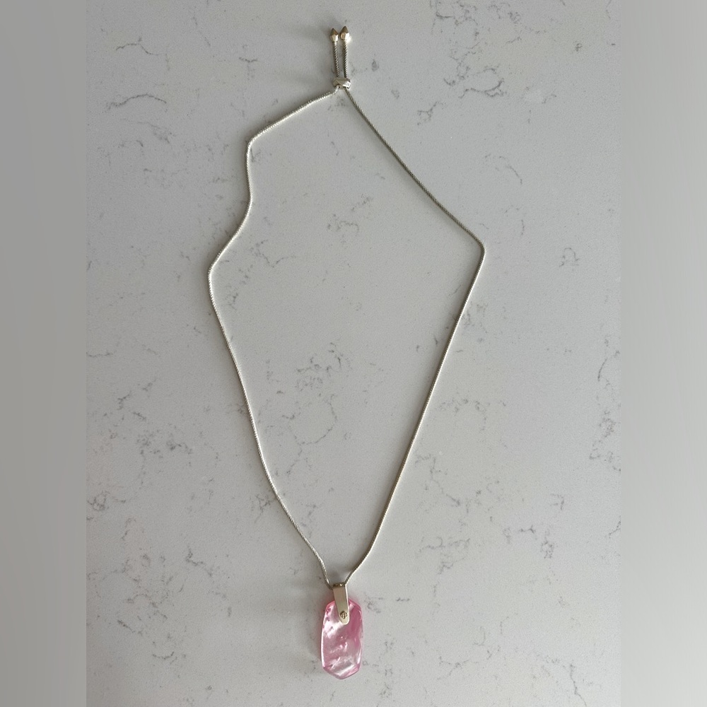 Kendra Scott long, gold pendant necklace with adjustable length